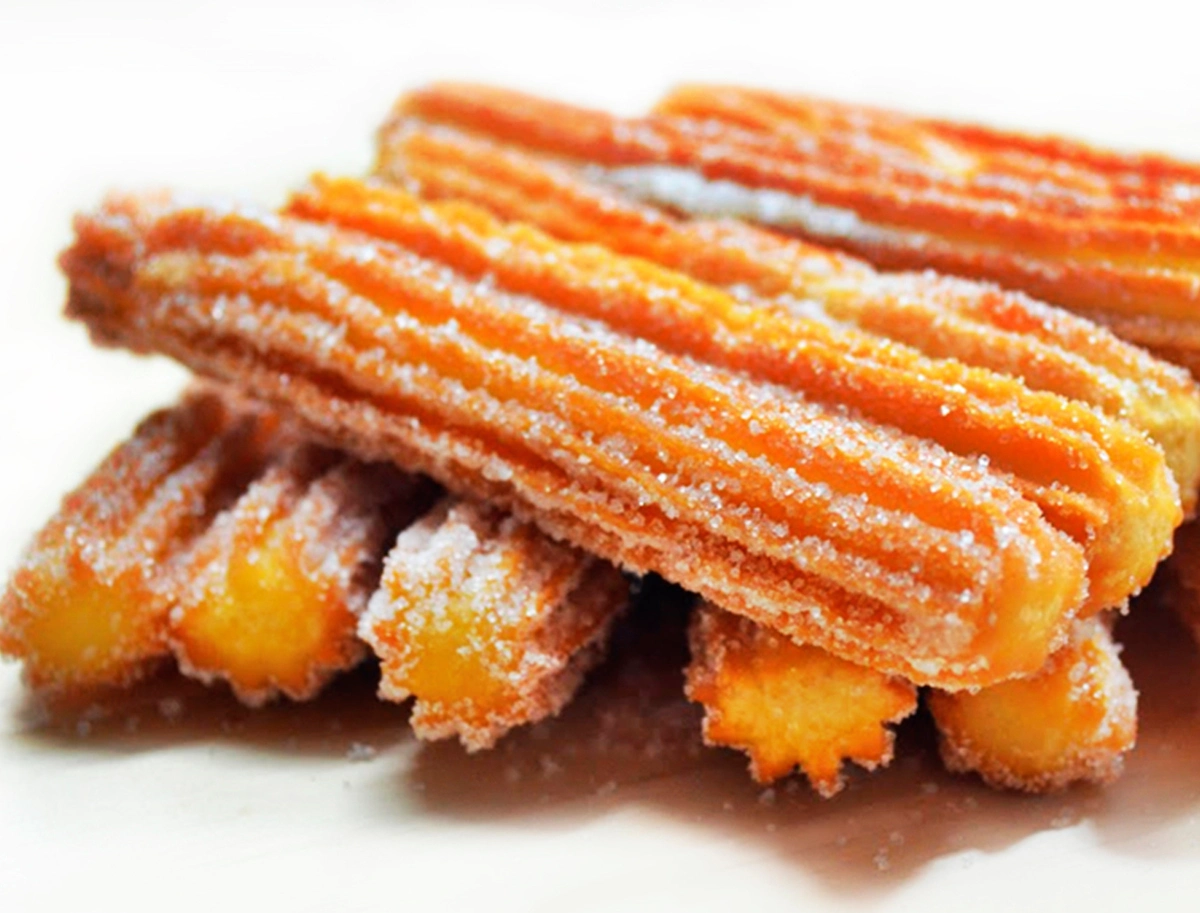 Churro espolvoreado azucar